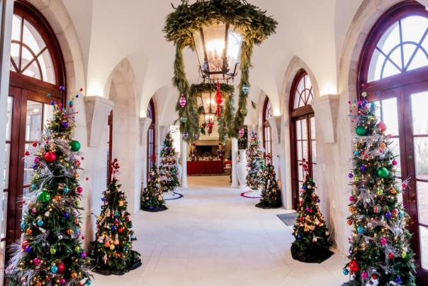 christmas trees adorn hallway