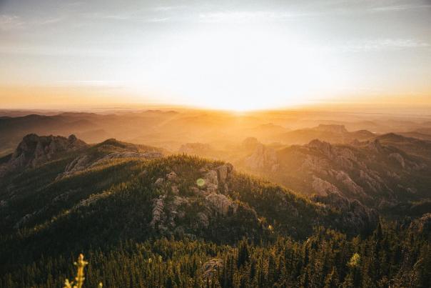 Sunset over Black Hills National Forest creating a golden hue over the land