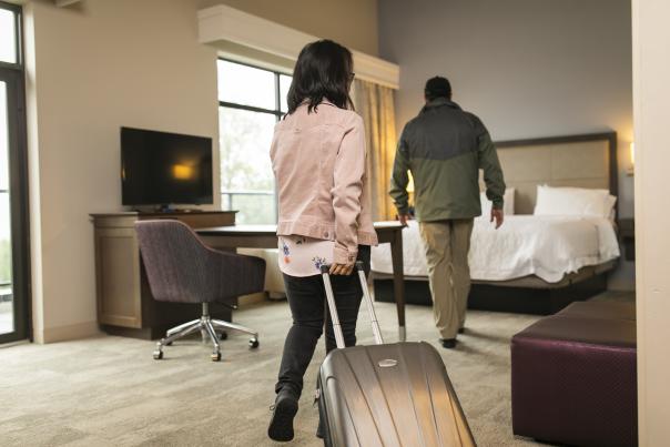 Hotel Guests with Suitcases