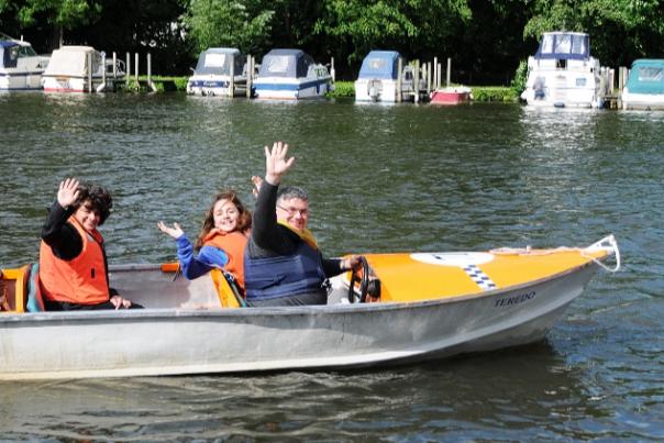 Family in a motor boat on the Thames at Henley