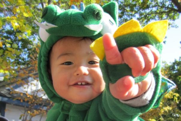 Little boy in dinosaur costume enjoys Zoo Boo at the Seneca Park Zoo