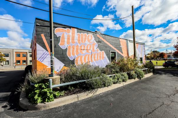 Mural in Rochester's East End neighborhood with the text Til We Meet Again.