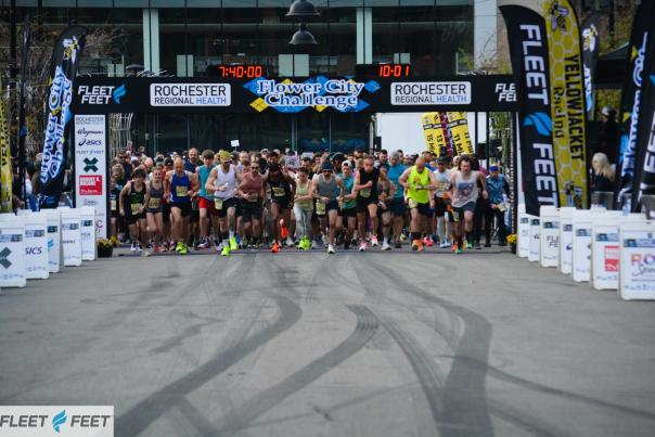 A group of runners beginning their run at the starting line of the Flower City Challenge race in Rochester, NY
