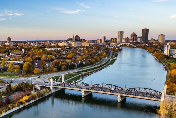 Genesee River and Rochester, NY city skyline with fall trees