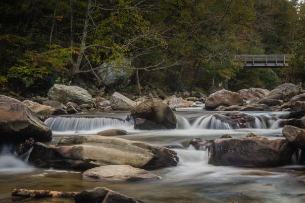 Water cascades down the Rocky Broad River in Chimney Rock, NC.