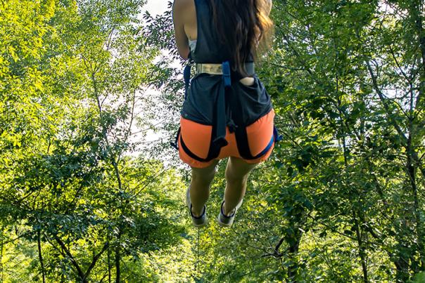 A visitor enjoys the ride down a zipline at Boulderline Zip near Lake Lure.