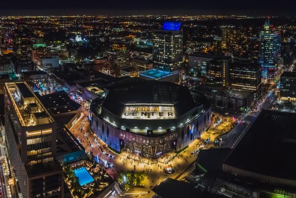 Aerial view at night of Golden1 Center, the Kimpton, and the downtown skyline.