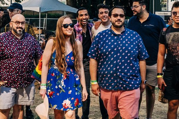 group of people from the LGBTQ community in Sacramento outdoors at a festival