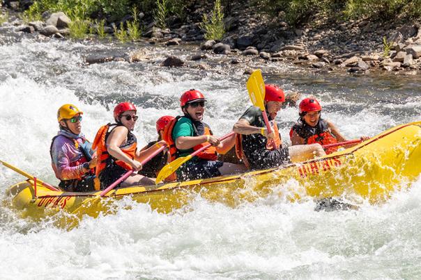 Group of people rafting at a river