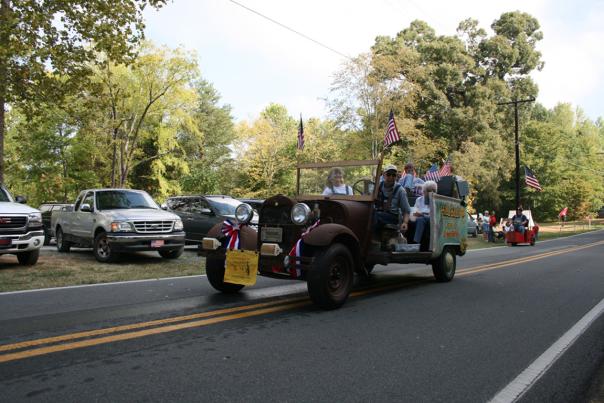 Antique car riding down road at Founders Day Festival