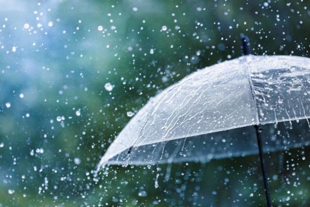 Rain hitting umbrella stock photo