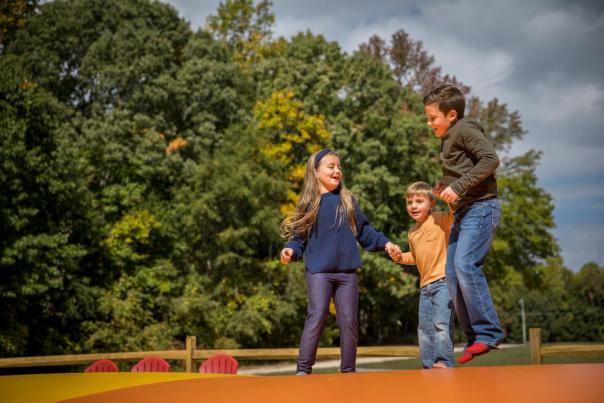 Kids jumping on giant pillow at Cherry Treesort