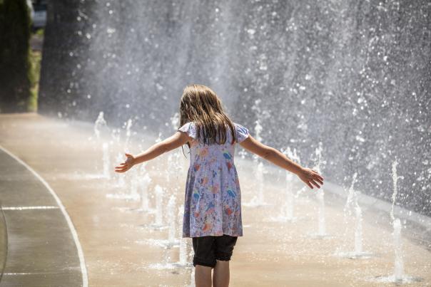 Girl playing in water at park