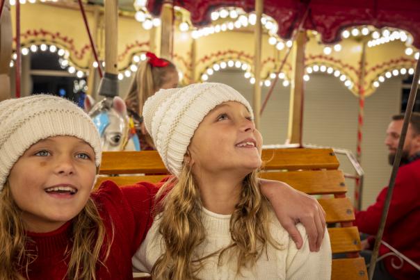 Girl Looking up at Lights on Carousel