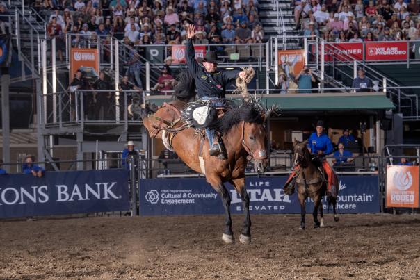 This photo depicts Brody Wells riding Black Tie (Horse) at a Utah Days of '47 Rodeo in Salt Lake.