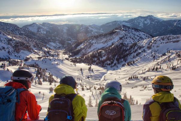 Skiers overlooking the snow-covered mountains at Snowbird