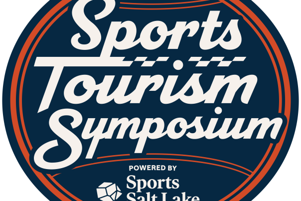 Ball with the words Sports Tourism Symposium powered by Sports Salt Lake on it