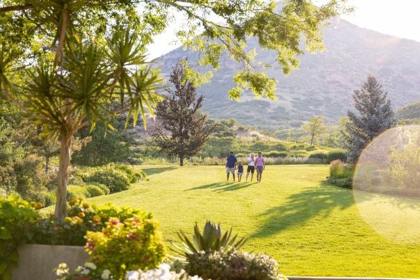Image of a family walking through Red Butte Garden