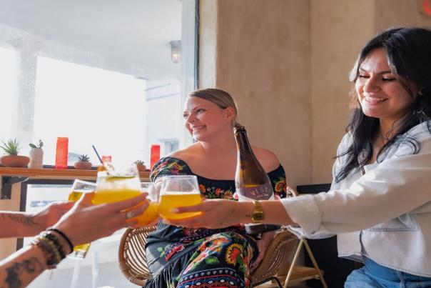 people cheersing drinks together