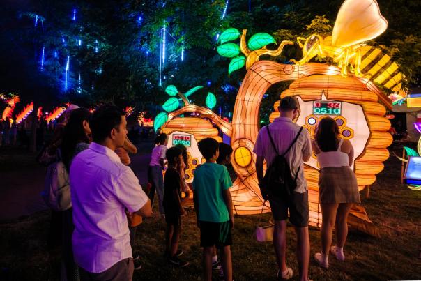 family at illuminate event at botanical garden