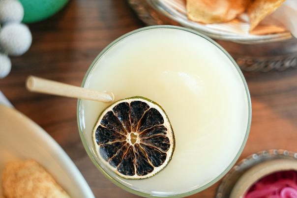 Overhead view of margarita with charred lime on top