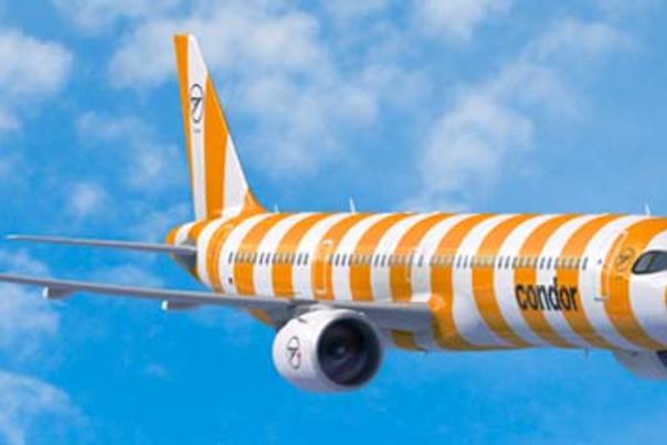 Yellow and white striped airplane in the air