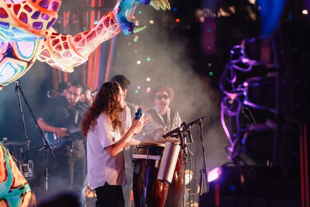 Band members on stage performing