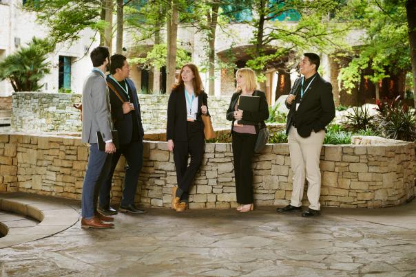 Group of meeting professionals gathering in front of grotto at Henry B.Gonzalez Convention Center