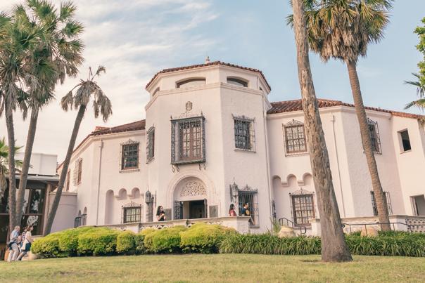 Exterior view of McNay Art Museum with palm trees