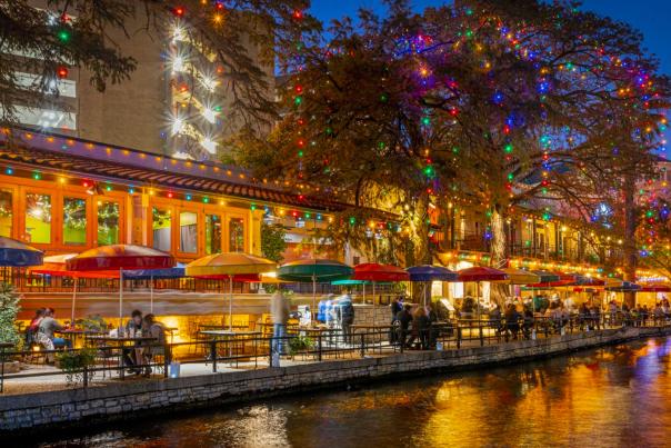 River Walk view with holiday lights adorned on trees