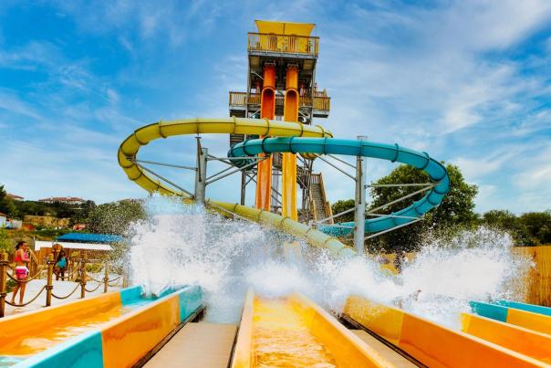 Splashdown at bottom of large waterslide