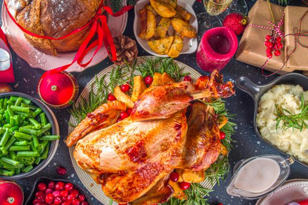 Holiday turkey dinner surrounded by sides