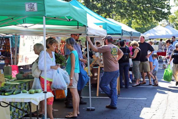 Heritage Sandy Springs Farmers Market booths with people shopping