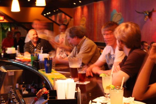 People drinking at a bar at a Sandy Springs restaurant