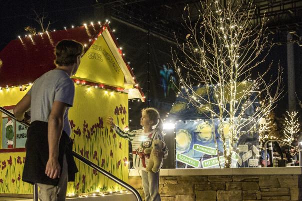 A young girl looking at the lights and decorations at the Sparkle Sandy Springs event at City Springs.