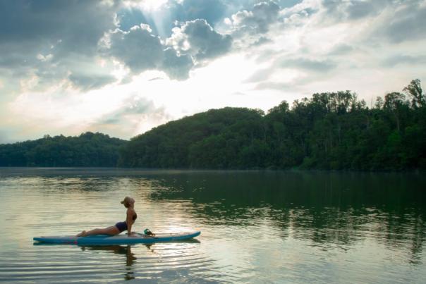 A woman does SUP Yoga on the Chattahoochee River in Sandy Springs, GA