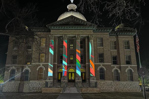 The Alignmentality installation is a projection of color and movement onto the columns of the Hays County Historic Courthouse!