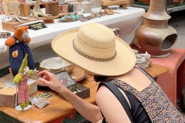 A woman peruses the pieces of art on sale at Eye of the Dog's annual Dirt Dauber Clay Festival. The event takes place in May every year in San Marcos, Texas and is a great place to find unique ceramic masterpieces.