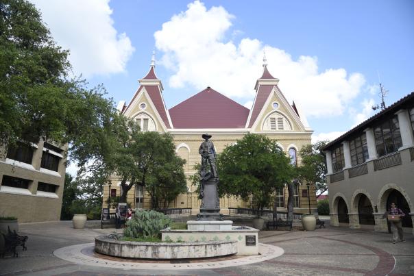 A photo of Old Main on the Texas State University campus in San Marcos, TX