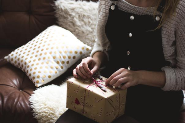 Girl wrapping a christmas gift
