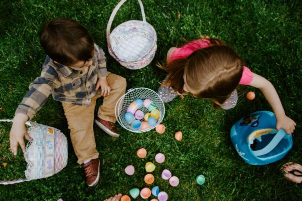 Children collecting Easter eggs at a park in San Mateo County