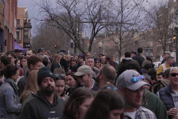 people in crowds lining the streets for chowder event