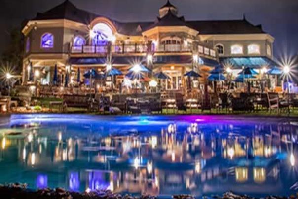 Saratoga national patio and water fountain at night lit up