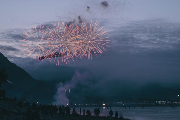 fireworks go off over resurrection bay in Seward, Alaska