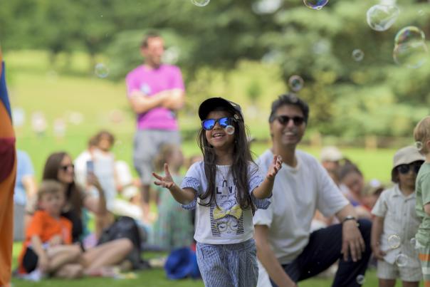 Children and adults enjoying the summer at Compton Verney