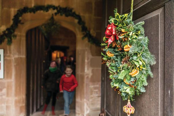Two girls and a Christmas wreath