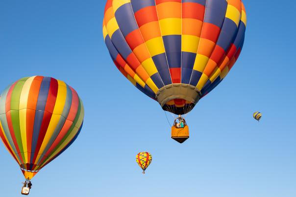 Colorful hot air balloons in the blue day sky
