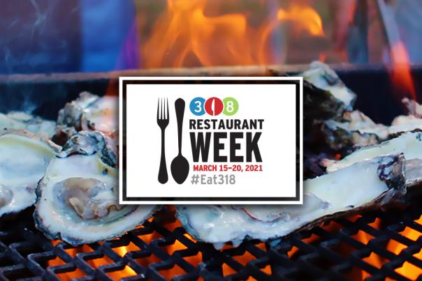 Oysters being grilled over an open flame in Shreveport-Bossier