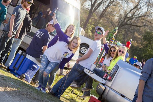 image of young adults partying in Shreve City for Mardi Gras