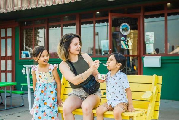 Photo of a Family Eating snowcones outside of Streetcar Station